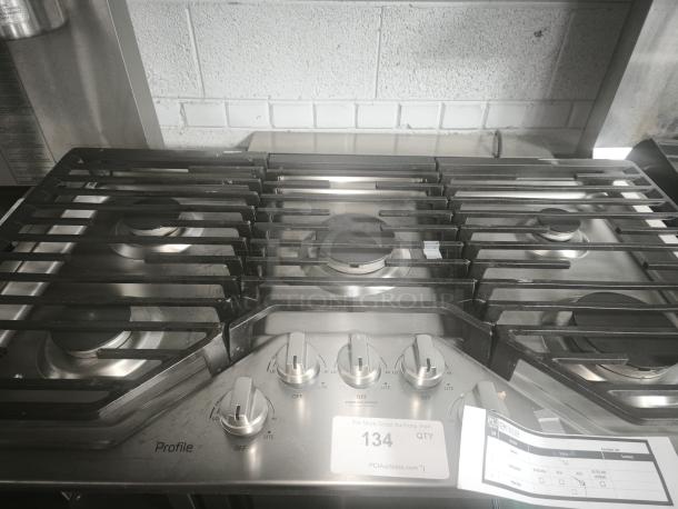 Profile 36 in. stainless steel gas cooktop, model PGP7036SLSS, like new, with 5 burners including Power Boil burners.