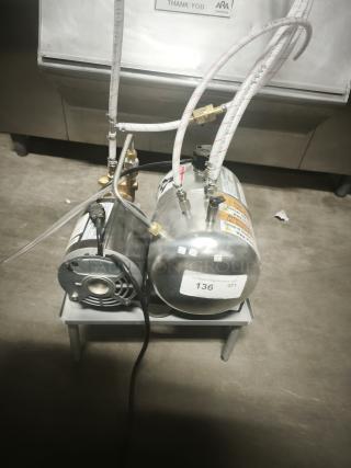 Stainless Steel Air Compressor Pump, compact and quiet on stand, with visible labels and hoses, tag reads "136 QTY".