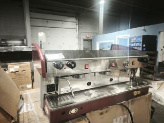Wega Atlas EVD 2-Group commercial espresso machine in good condition, stainless steel with red accents, control knobs visible.
