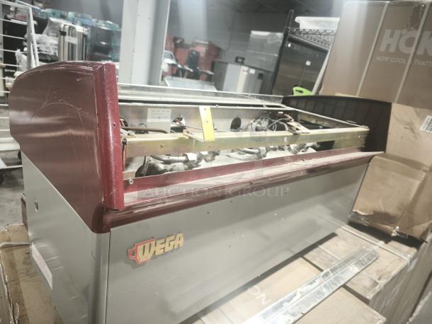 Wega Atlas EVD 2-Group Commercial Espresso Machine, used condition, visible wear on exterior, red and gray finish, Wega logo.