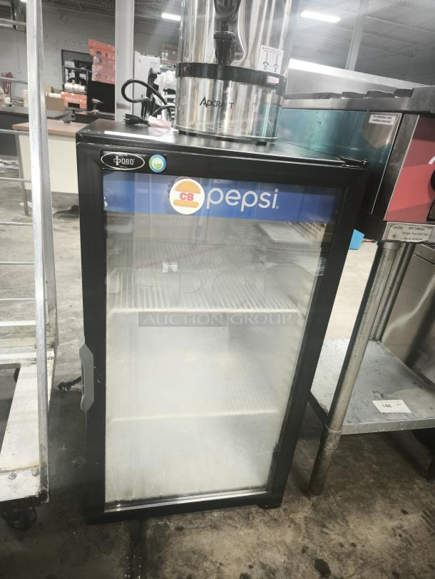 QBD Pepsi single-door glass merchandiser cooler, model visible, good condition, clear glass door, Pepsi branding.