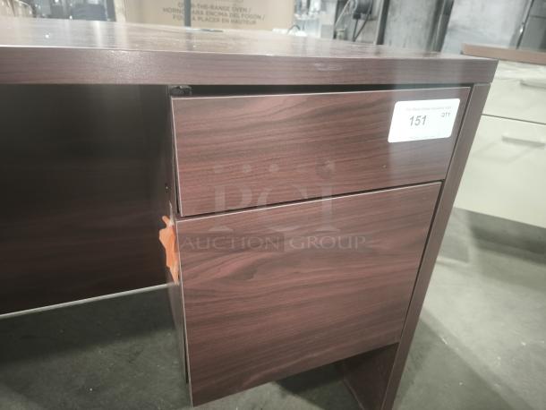 10500 Series left return pedestal desk with mahogany finish, two drawers, good condition, label reads "151 QTY".