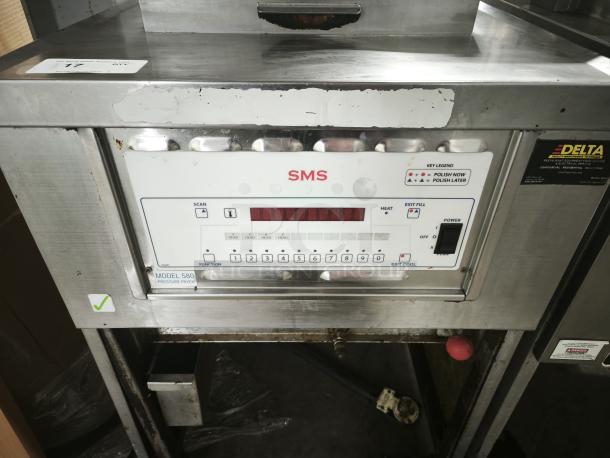 SMS Computron 8000 pressure fryer, stainless steel, model 580, working before removal. Features control panel and function keys.