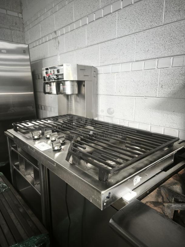 Profile 36" stainless steel gas cooktop, model PGP7036SLSS, in like-new condition. Features 5 burners with Power Boil.