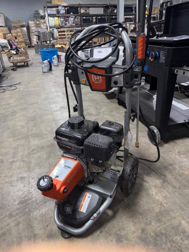 Husqvarna PW-3200 gas pressure washer, model 022007, 3200 PSI, tested and working, includes hose and nozzle, minor wear.