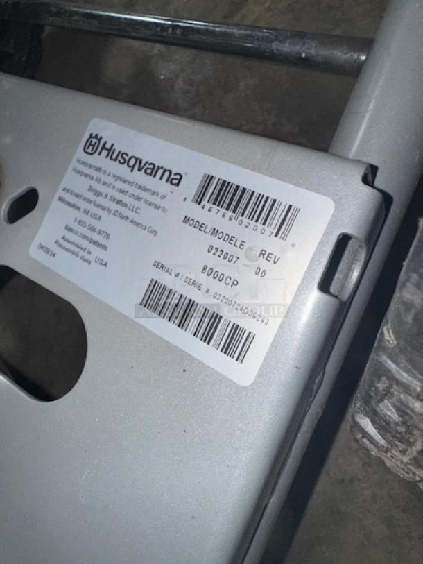 Husqvarna PW-3200 gas pressure washer label, model 022007, indicating 3200 PSI; serial number and manufacturer details visible.