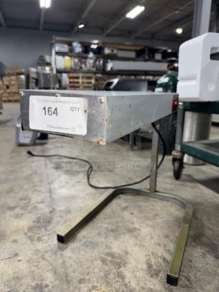 Nemco 6152-24 single rod strip warmer with fixed arm, built-in toggle switch, tested, metal frame, model label visible.