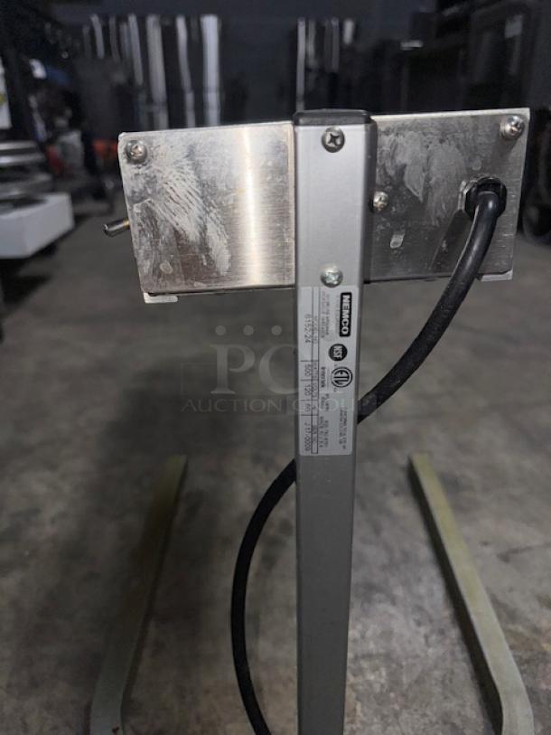 Nemco 6152-24 single rod strip warmer with fixed arm. Visible label with model number and power details shown.