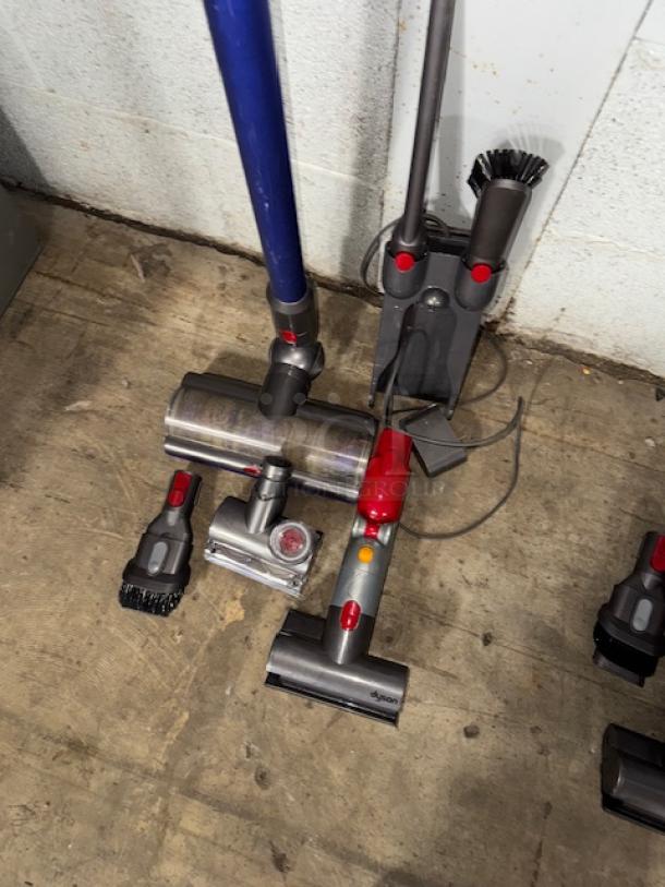 Dyson V11 Torque Drive Cordless Vacuum Cleaner with attachments; appears gently used with visible marks.