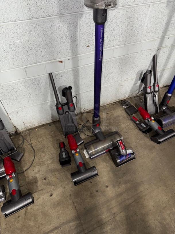 Dyson V11 Torque Drive + cordless vacuum cleaner, excellent condition, purple and gray, includes multiple attachments.