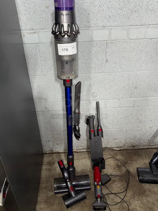 Dyson V11 Torque Drive + cordless vacuum cleaner, blue, includes attachments, gently used, auction tag 176 visible.