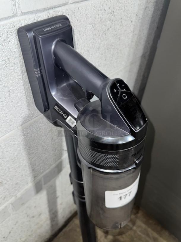 SAMSUNG cordless vacuum cleaner, gray, in good condition, tested and working; visible control panel and labels.