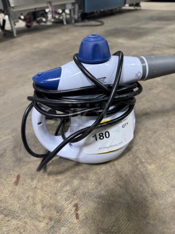 BISSELL Steam Shot 39N75 handheld steam cleaner, model 4171F, white, 1000W, 6.6 oz tank, with power cord and caution label.