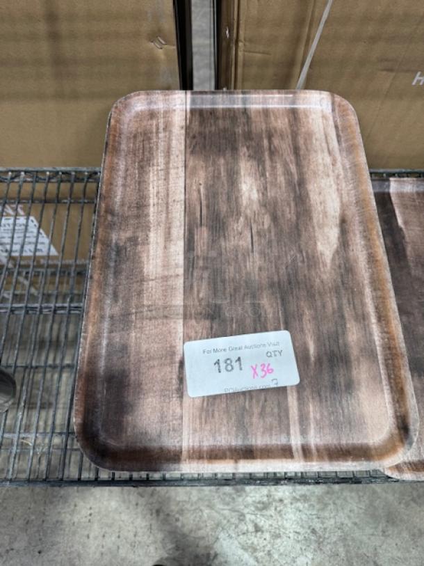 12"x16" molded fiber tray, brown finish, placed on metal rack. Tag with number "181" and "X36" visible on surface.