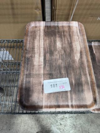 12"x16" molded fiber tray, brown finish, placed on metal rack. Tag with number "181" and "X36" visible on surface.