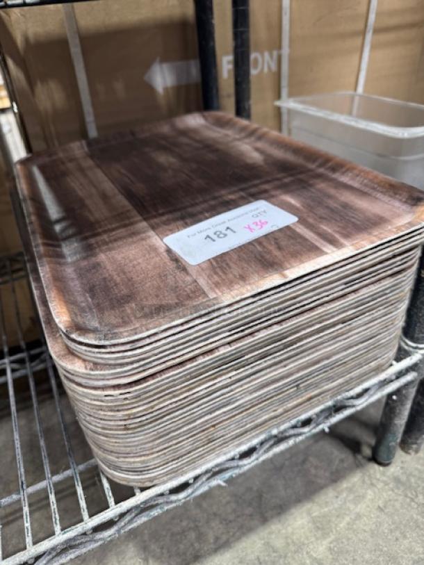 Stack of 12"x16" molded fiber/pulp trays in good condition, suitable for restaurants or catering. Marked with lot number 181.