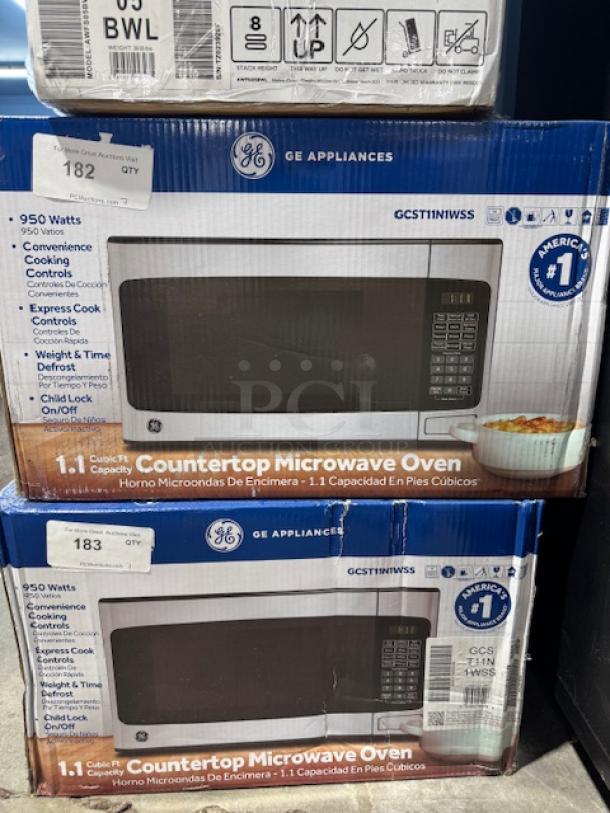 BRAND NEW GE 2.2-cu ft 1100-Watt Microwave, Stainless, Model GCSH22U1WSS. Box shows GE branding and features list.