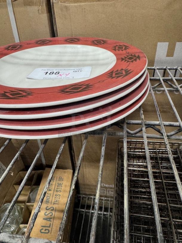 CERAMIC wide rim rolled edge stoneware plates, red with black geometric pattern, good condition, stacked on shelf.