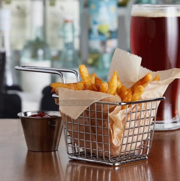 Mini stainless steel fry basket, square with handles, holding fries. Perfect for serving appetizers. Excellent condition.