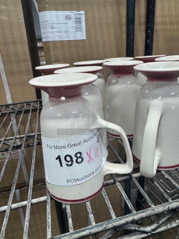White mugs with red stripes by Homer Laughlin, set of 10, good condition, displayed on a metal shelf.