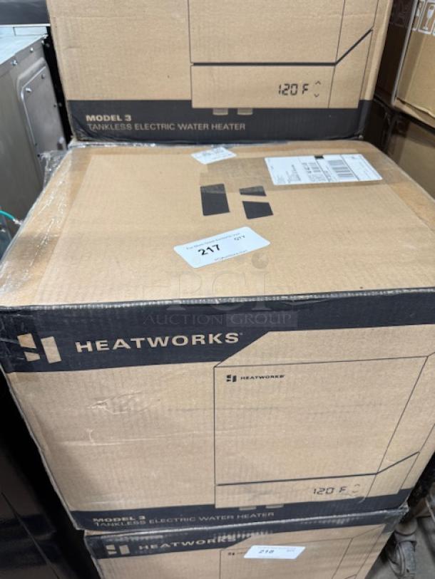 Boxed Heatworks Model 3 electric tankless water heater, model HW‑0007, in brand new condition.