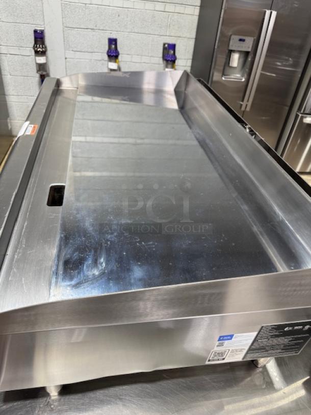 Brand new Cooking Performance Group 48" gas griddle, model 351gtucpg48l, chrome plated, 4 burners, 120,000 BTU.