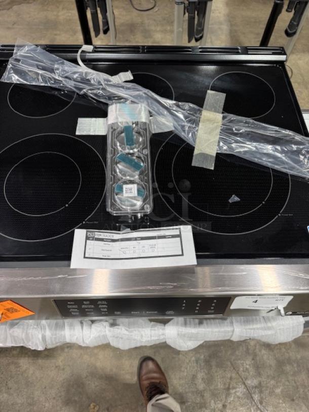 BRAND NEW GE® 30" Slide-In Electric Convection Range, Model GRS600AVFS, with air fry and EasyWash™ tray. Tags visible.