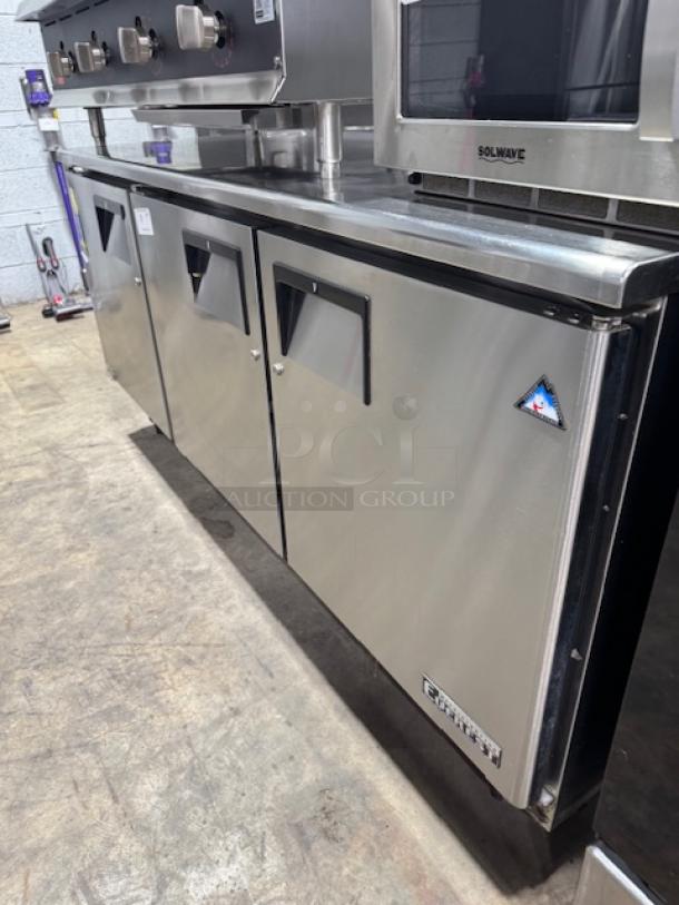 Like new Everest Refrigeration ETBF3 undercounter freezer with 3 sections and doors, stainless steel, 71 1/8" W.