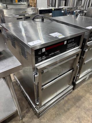 Henny Penny AHC-993 humidified heated pass-thru cabinet, stainless steel, tested and working, model number visible.