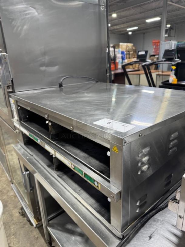 Prince Castle DHB2PT-33KFCB warming unit, stainless steel, two 24" compartments, excellent condition, 33" wide, tested and working.