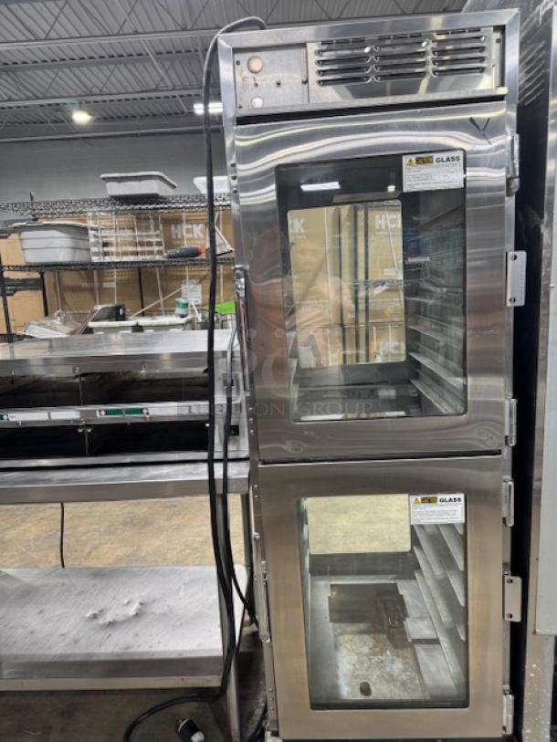Henny Penny AHC-990 Heated Holding Cabinet in excellent condition on casters, dual glass doors, tested and working, 240v/1ph.
