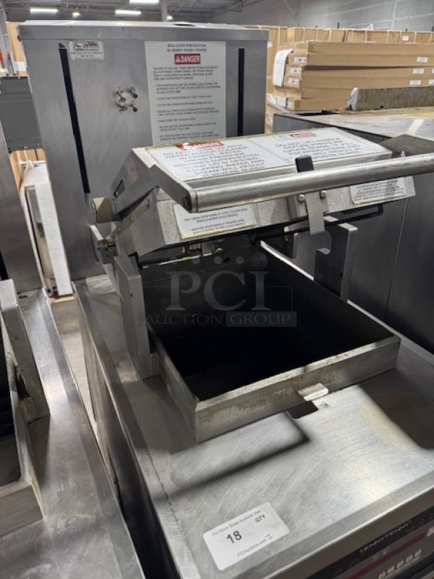 Henny Penny Computron 8000 pressure fryer, stainless steel, used condition, safety and operation labels visible.