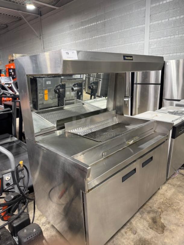 Delfield fry dump station, 42" stainless steel, in good condition, 120V, tested and working, for fast service.