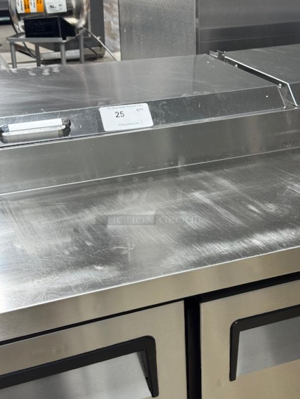 ATOSA MPF8202GR 2-door pizza prep table in excellent condition, stainless steel, tested and working, label on top surface.