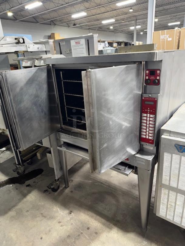 BLODGETT commercial electric convection oven, stainless steel, open doors, multiple racks, digital control panel, used condition.