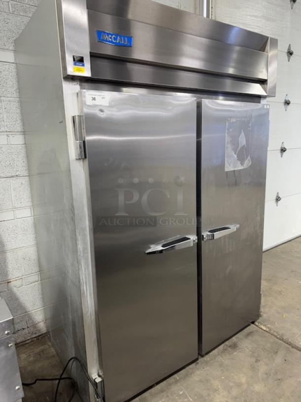 McCall 2-door solid reach-in freezer, Model 4-4045F, stainless steel, commercial-grade, good condition, visible brand logo.