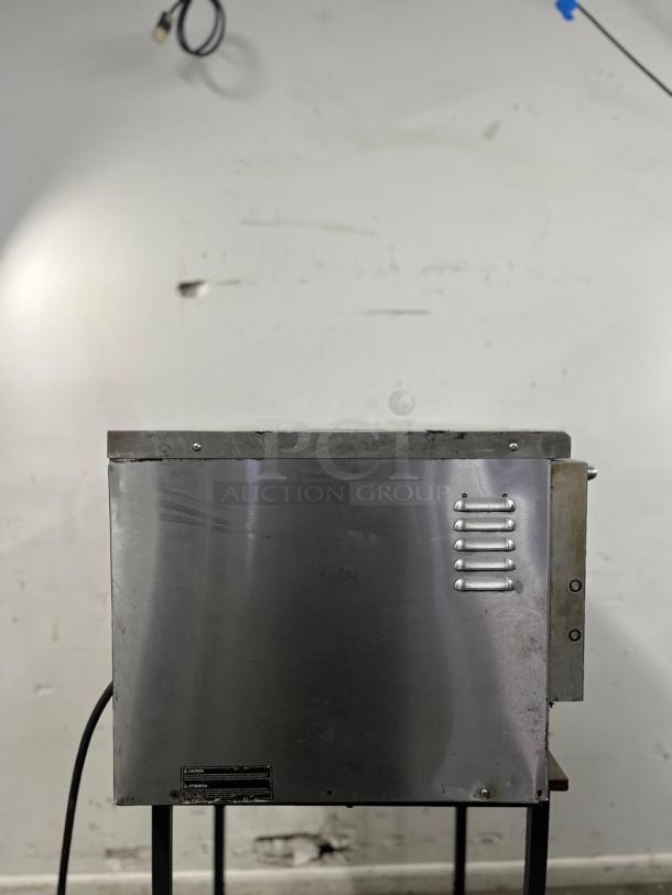 TURBOCHEF NGC commercial-grade ventless high-speed oven. Stainless steel, vent design, caution label visible.