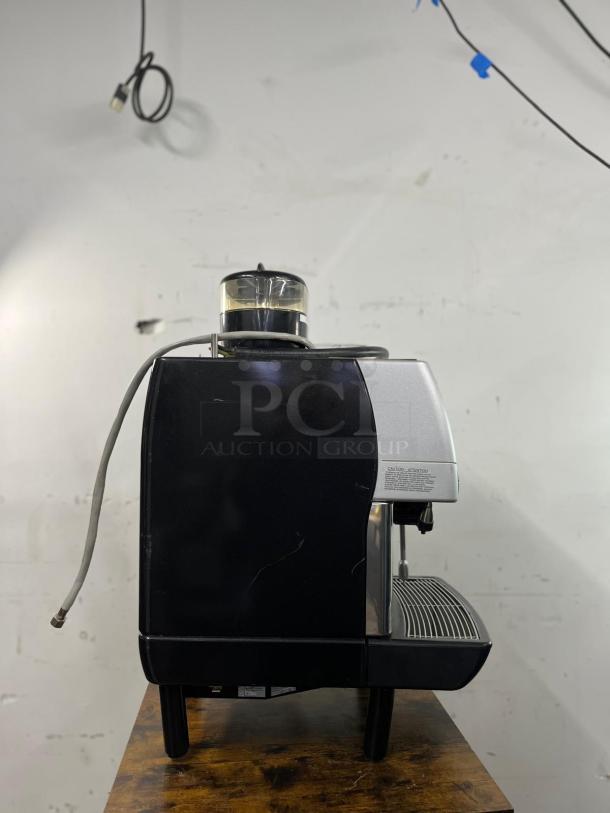 La Cimbali M2 Barsystem, commercial espresso machine, black and silver, visible water container, good condition.