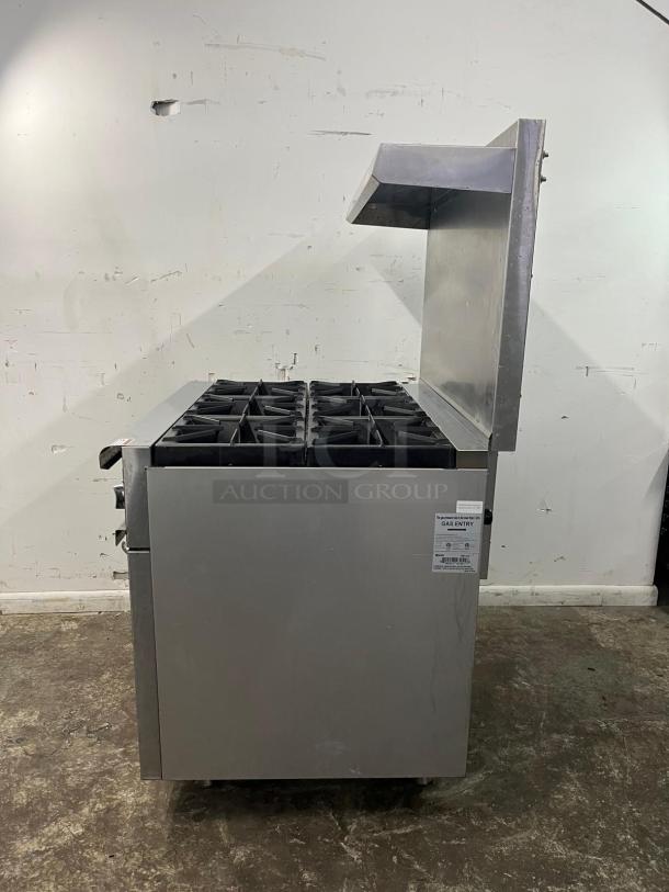 BRAND NEW Omcan 43151 36" gas range with 6 open burners; 211000 BTU; side view; condition: excellent; visible gas entry label.