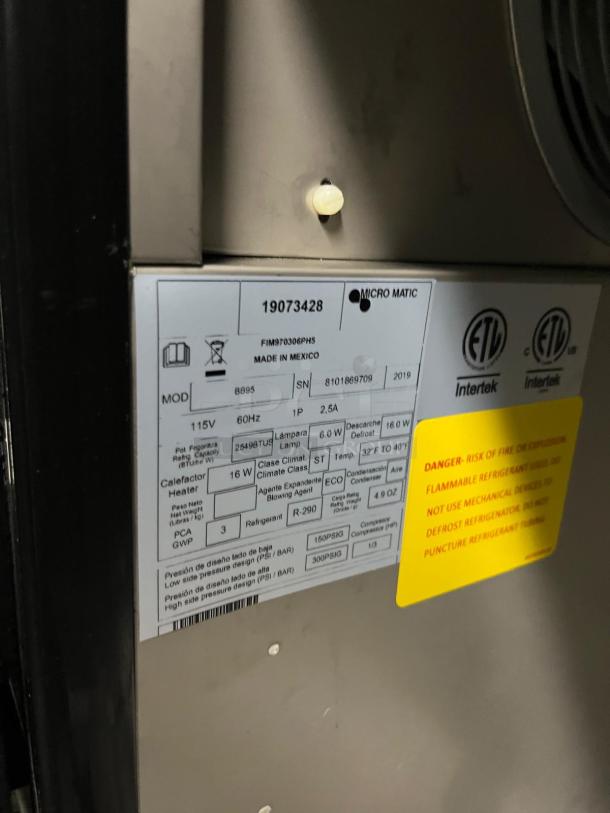 BRAND NEW Micro Matic BB95, 95" refrigerated back bar cabinet, 39.2 cu ft, black vinyl, labels show model and safety warnings.