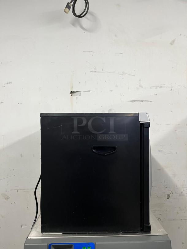 Brand new Weston Pro-1200 digital dehydrator, 12 trays, 80L capacity, black exterior, side handle, model PRO-1200.