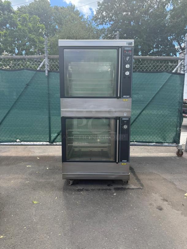Hobart HRW 303 electric rotisserie oven and warmer, stainless steel, dual compartments, pristine condition, clear front panels.