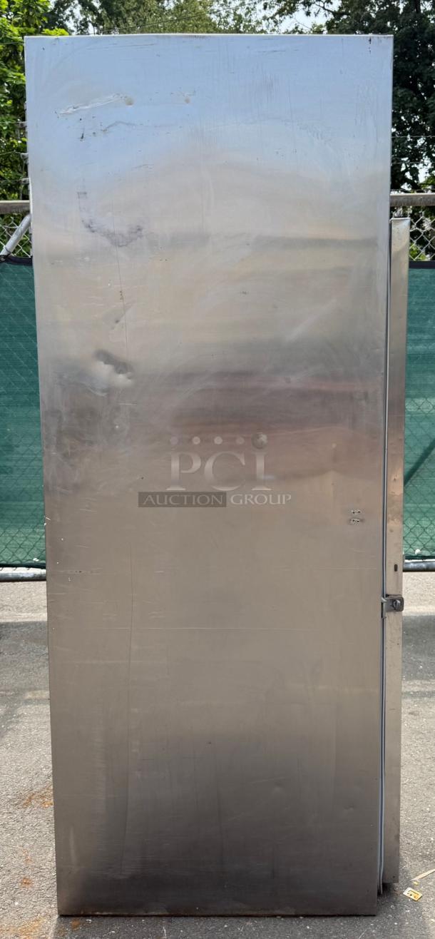 TRAULSEN ART 1-32 36" stainless steel roll-in refrigerator with solid door, minor scratches visible, industrial-grade.