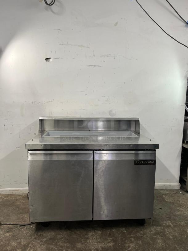 Continental SW48-12 refrigerated sandwich prep unit, 48", 13.4 cu ft, stainless steel, dual doors, good condition.