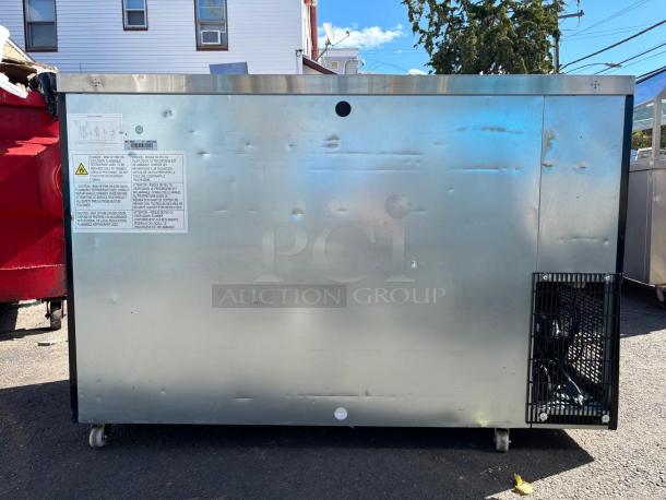 DUKERS DBB60 Kegerator, black, used condition, side view showing metal surface and ventilation. Tested and working.