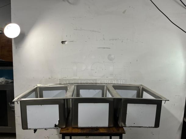 BRAND NEW Regency 16-Gauge Stainless Steel Three Compartment Drop-In Sink, Model 600DI31612. Durable, pristine condition.