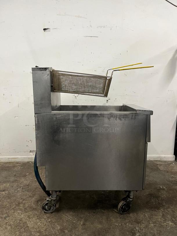 Pitco SG14-S gas fryer, commercial model, 40-50 lb. oil capacity, 110,000 BTU, natural gas, floor model, used condition.