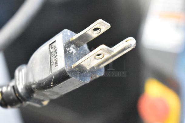 Close-up of a power plug for the Autec Audio-Technica ASM865A Sushi Maker Machine, showing prongs and voltage markings.