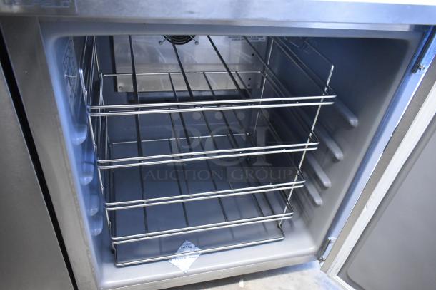 2021 Delfield 406P-STAR4 stainless steel single-door undercounter cooler, shows interior shelves and visible label.