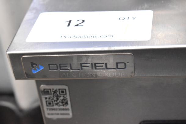 2020 Delfield 406P-STAR2 stainless steel undercounter cooler with label and QR code, on commercial casters.